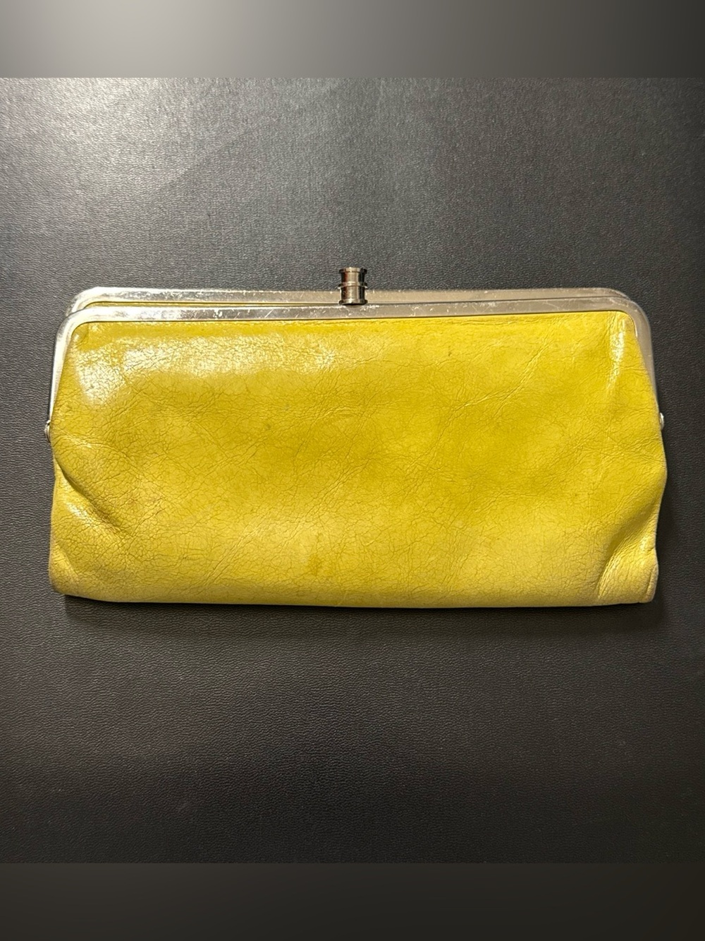 Hobo Lauren clutch wallet made of genuine, vintage leather in a lemongrass